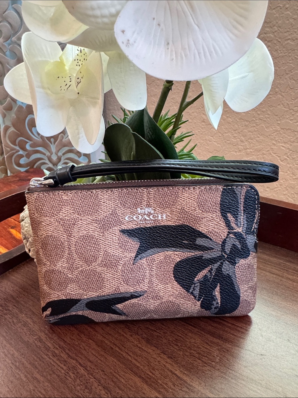 COACH Brown Signature Wristlet with Black Bow Print